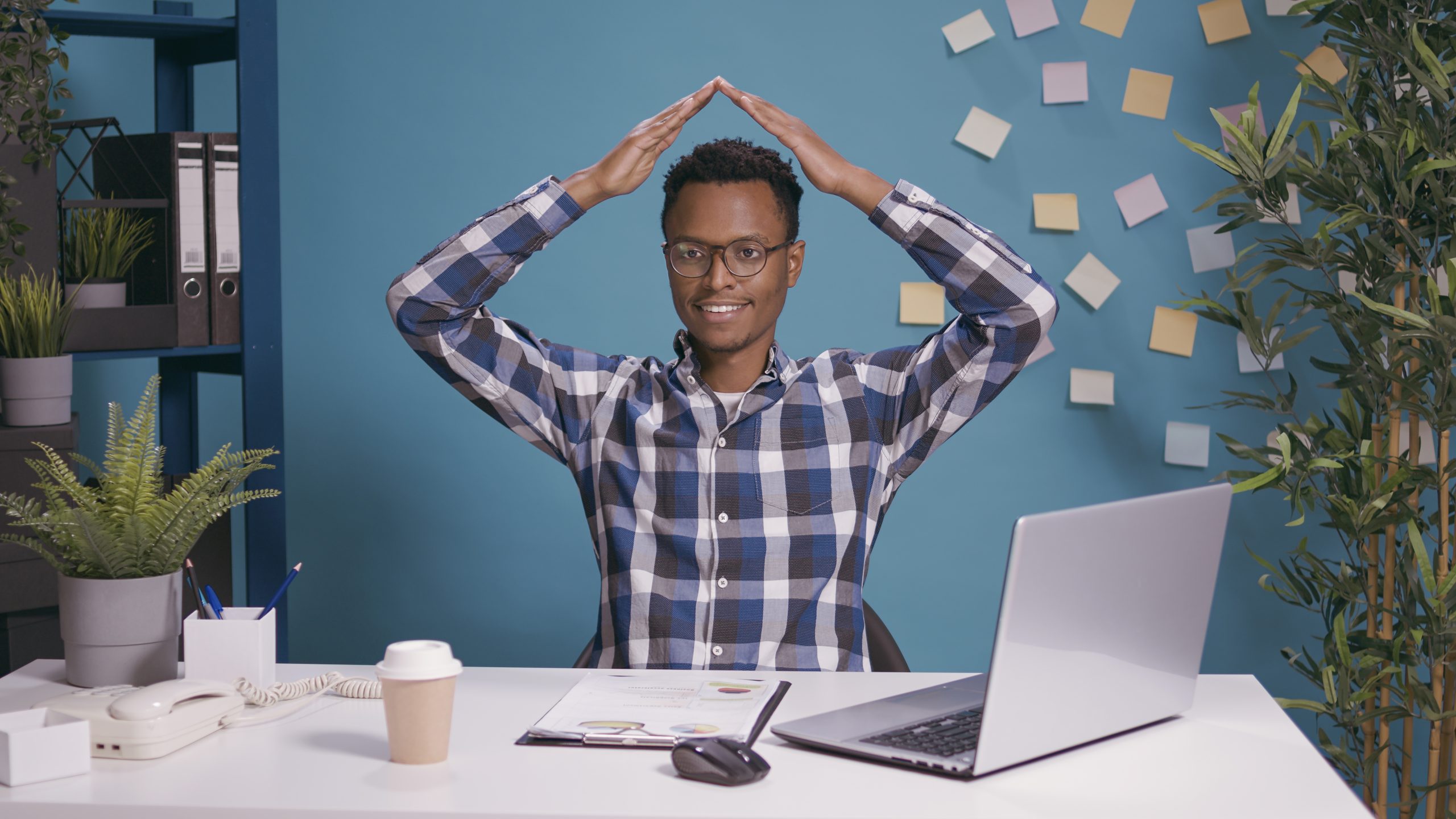 company-employee-doing-house-roof-gesture-with-arms-feeling-safe-secure-inside-man-feeling-protected-advertising-safety-symbol-wishing-home-protection-life-insurance-scaled.jpg
